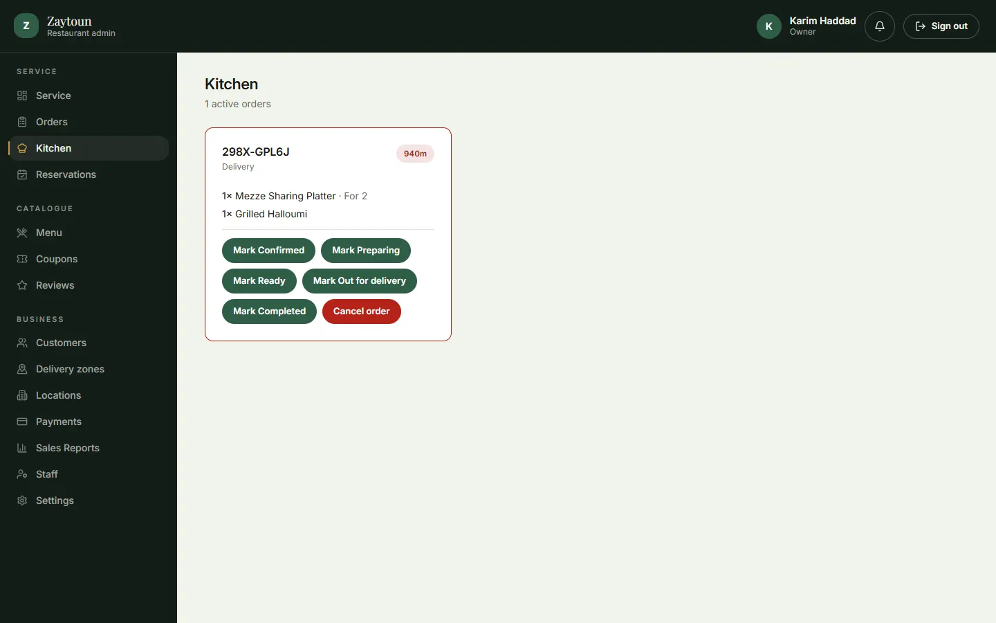 Admin kitchen view showing an active order ticket with one-tap status buttons